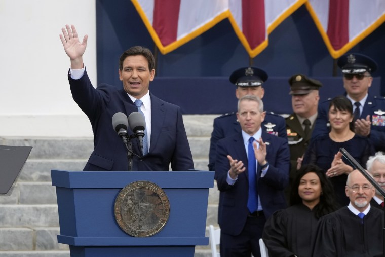 Ron DeSantis waves to the crowd after being sworn in to begin his second term during an inauguration ceremony outside the Old Capitol in Tallahassee, Fla