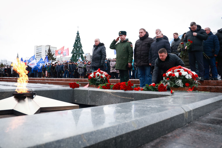 Mourners gather to lay flowers in memory of more than 60 Russian soldiers that Russia says were killed in a Ukrainian strike on Russian-controlled territory, in Samara