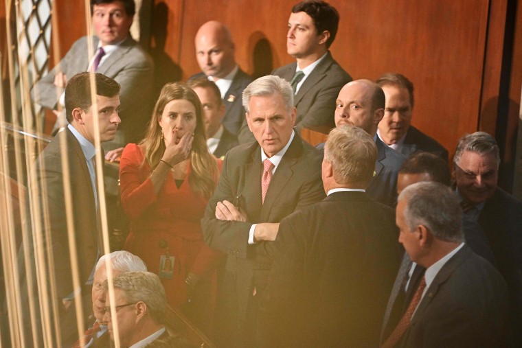 US Representative Kevin McCarthy (R-CA) (C) reacts during a conversation as voting continues for new speaker at the US Capitol in Washington, DC, on January 5, 2023. - The US House of Representatives plunged deeper into crisis Thursday as Republican favorite Kevin McCarthy failed again to win the speakership -- entrenching a three-day standoff that has paralyzed the lower chamber of Congress.