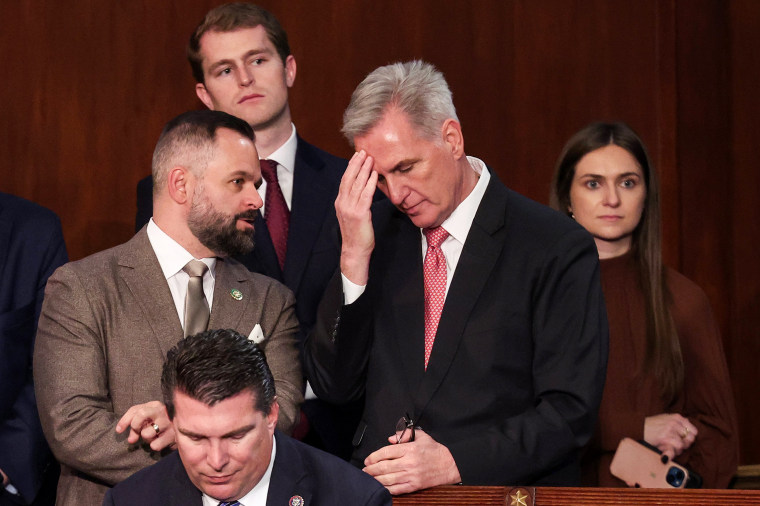 Rep.-elect Cory Mills, R-Fla., talks to House Republican Leader Kevin McCarthy, R-Calif., during the third day of elections for Speaker of the House on Jan. 5, 2023.