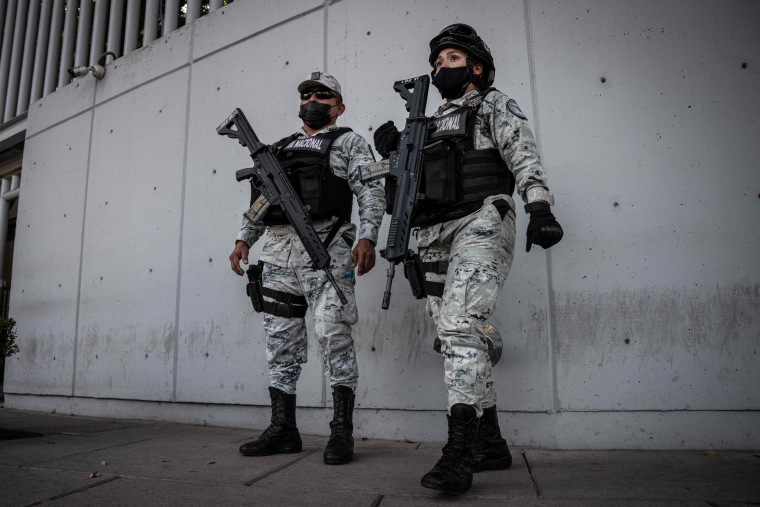Members of the Mexican National Guard stand guard outside the Attorney General's Office for Special Investigations on Organized Crime (FEMDO) in Mexico City