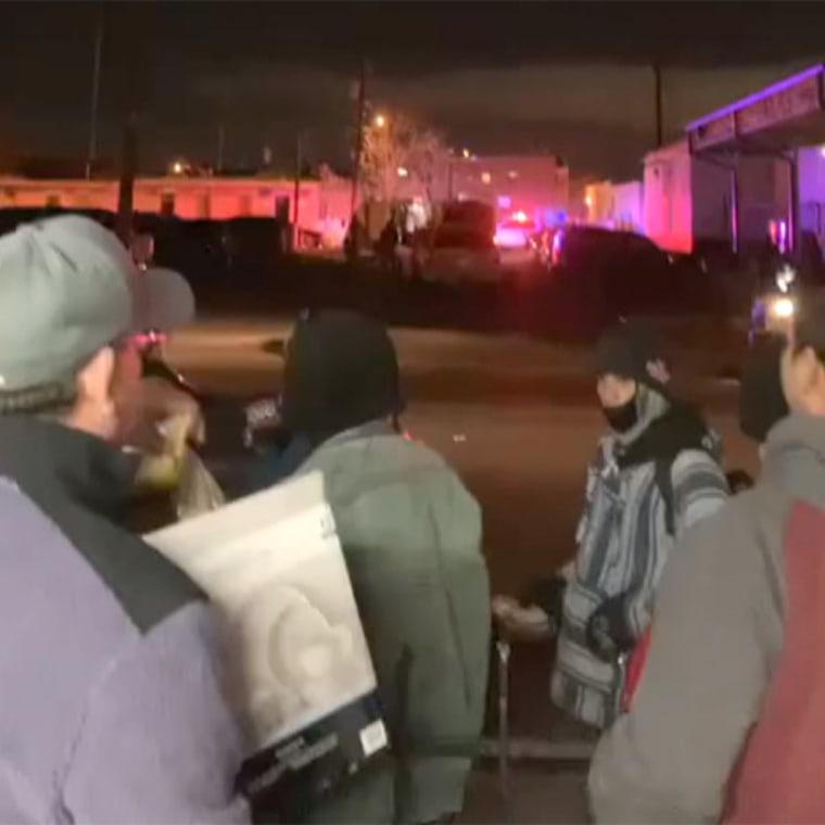 Footage obtained by NBC News shows Customs and Border Protection agents and the El Paso City Police Department on the street outside a Catholic church shelter and bus stop.