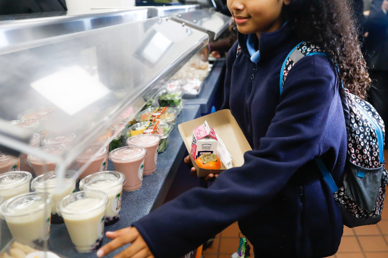 A child selects lunch at John Liechty Middle School