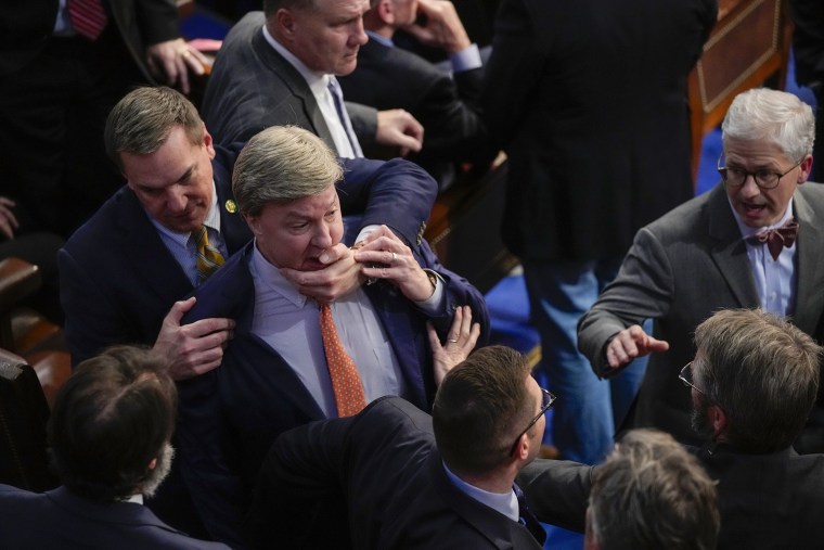 Rep. Richard Hudson, R-N.C., left, pulls Rep. Mike Rogers, R-Ala., back as they talk with Rep. Matt Gaetz, R-Fla., and other during the 14th round of voting for speaker as the House meets for the fourth day to try and elect a speaker and convene the 118th Congress in Washington, Friday, Jan. 6, 2023. At right is Rep. Patrick McHenry, R-N.C.