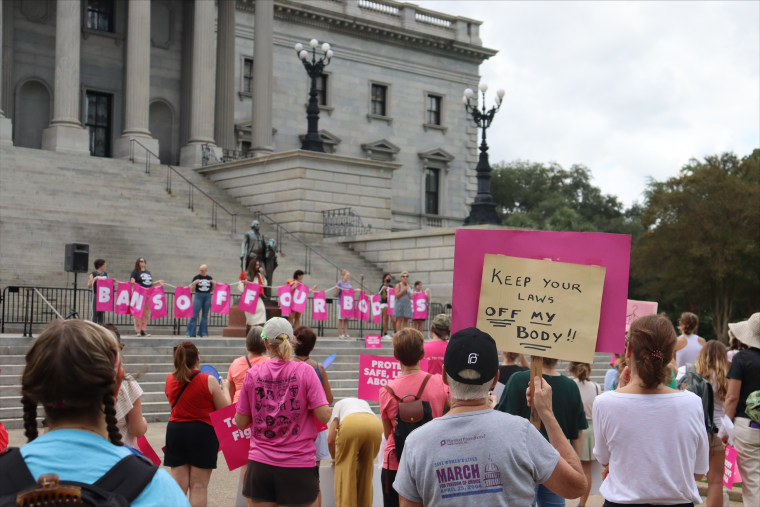 Protesters gather outside the state house in opposition to a proposed abortion ban, in Columbia, S.C.