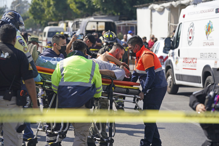 A subway passenger is taken on a stretcher after two subway trains collided in Mexico City