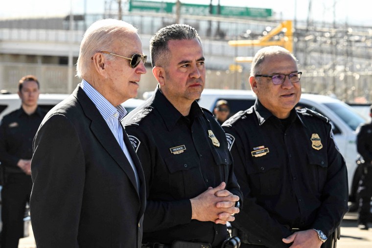 President Joe Biden speaks with Customs and Border Protection police on the Bridge of the Americas border crossing with Mexico in El Paso, Texas, on Jan. 8, 2023.