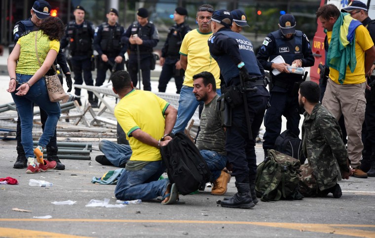 Security forces arrest supporters of Brazilian former President Jair Bolsonaro after retaking control of Planalto Presidential Palace in Brasilia, Brazil,