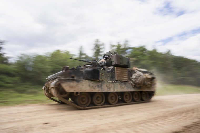 A U.S. Army M2/M3 Bradley infantry fighting vehicle drives along a road during a multinational exercise at Hohenfels Training Area in Germany on June 8, 2022.