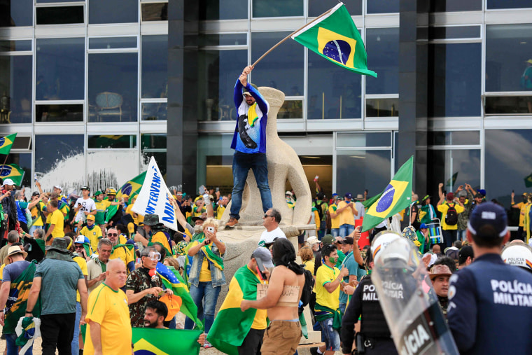 Supporters of Brazilian former President Jair Bolsonaro invade the Planalto Presidential Palace while clashing with security forces in Brasilia on Jan. 8, 2023.