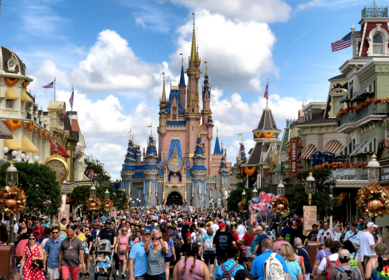 Crowds fill Main Street USA in front of Cinderella Castle at Walt Disney World in Lake Buena Vista, Fla., in 2021. 