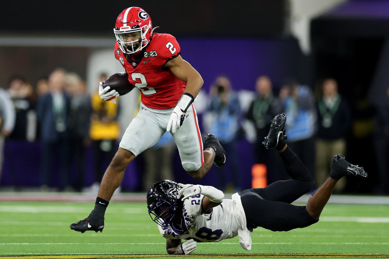Kendall Milton #2 of the Georgia Bulldogs runs with the ball against Millard Bradford #28 of the TCU Horned Frogs in the second quarter during the College Football Playoff National Championship game at SoFi Stadium on January 09, 2023 in Inglewood, California.