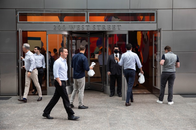 People enter the Goldman Sachs headquarters building in New York