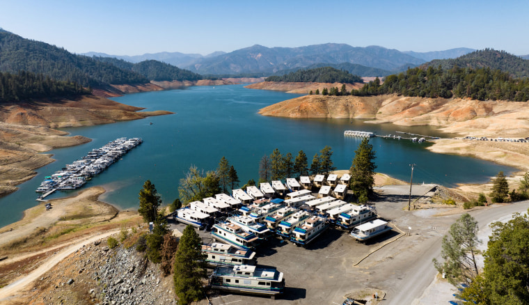 Houseboats are parked out of the water at a Shasta Lake marina in Lakehead, Calif., on Oct. 16, 2022.
