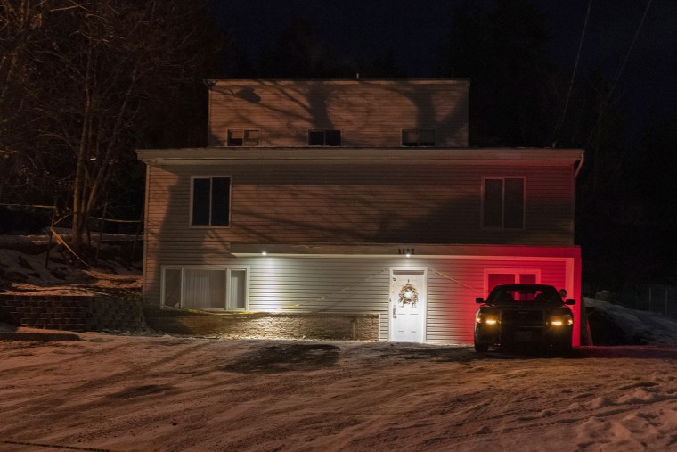 A private security officer sits in a vehicle Jan. 3, 2023, in front of the house in Moscow, Idaho where four University of Idaho students were killed in November. Image: