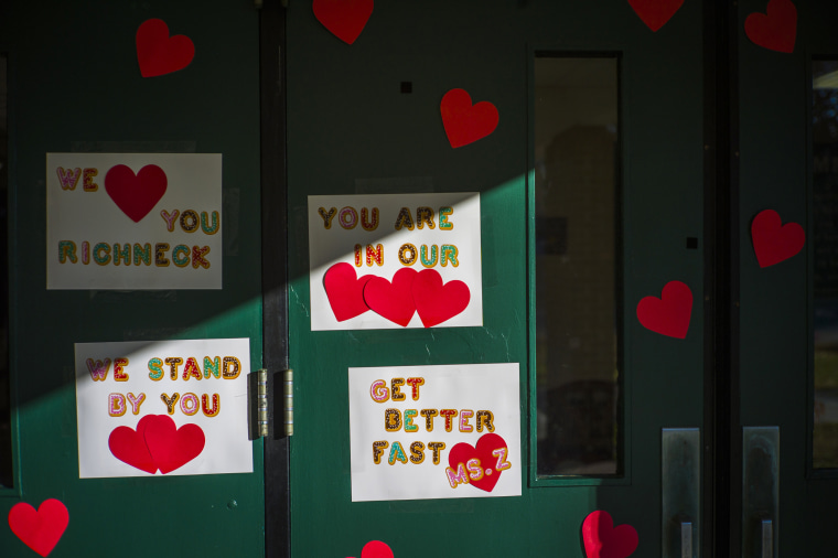 Messages of support for teacher Abby Zwerner grace the front door of Richneck Elementary School in Newport News, Va.