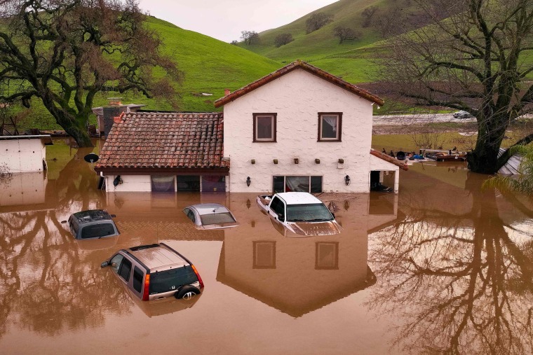 Heavy rain lashed water-logged California Monday, with forecasters warning of floods as a parade of storms that have killed 12 people battered the western United States. 