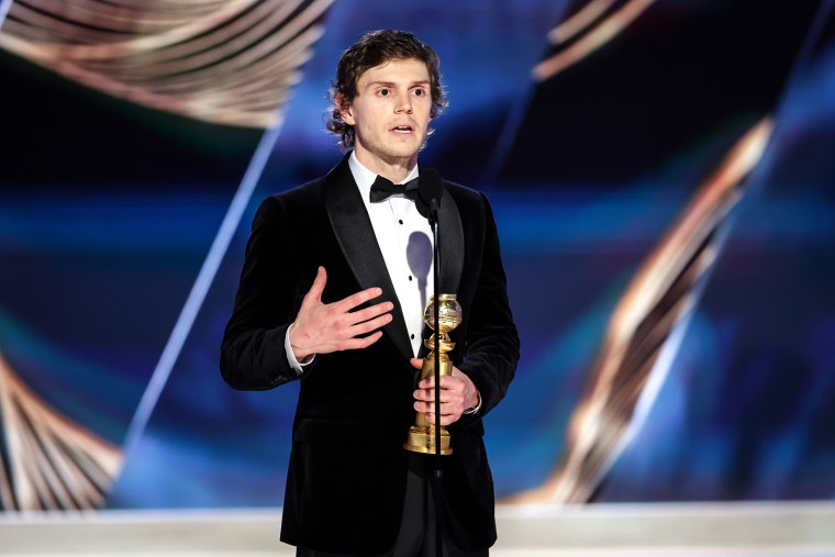 Evan Peters accepts the Golden Globe for best actor in a limited or anthology series or television film for "Dahmer — Monster: The Jeffrey Dahmer Story" on Tuesday.