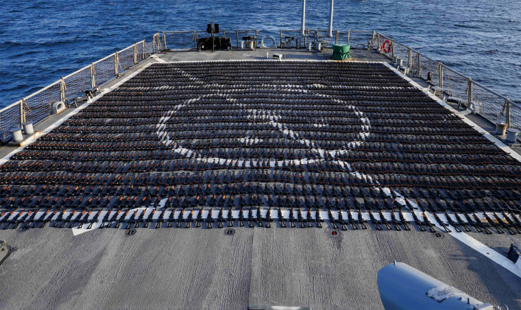 Thousands of AK-47 assault rifles sit on the flight deck of guided-missile destroyer USS The Sullivans (DDG 68) during an inventory process on Jan. 7, 2023.
