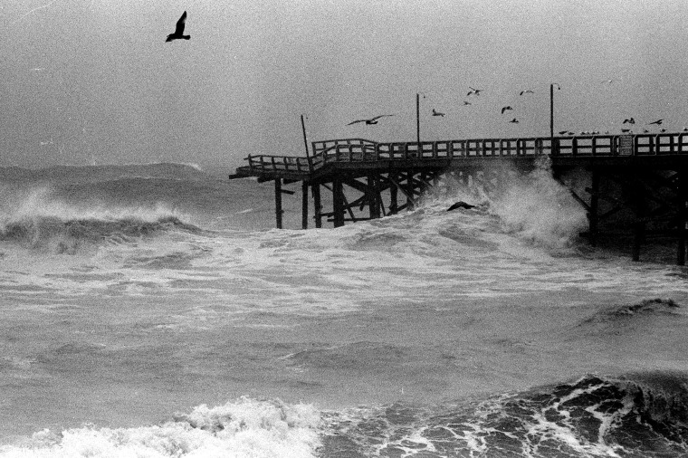 FILE - In this Jan. 27, 1983 file photo, the landmark Crystal Pier in the San Diego community of Pacific Beach collapses under the force of surging waves during an El Nino storm. One hundred feet of the 56-year-old structure was lost. Evidence is mounting that the El Nino ocean-warming phenomenon in the Pacific will spawn a rainy winter in California in 2015, potentially easing the state’s punishing drought but also bringing the risk of chaotic storms like those that battered the region in the late 1990s. A strong El Nino arrives about once every 20 years. Ocean temperatures show this one to be the second-strongest since such record keeping began in 1950. That would make it weaker than the El Nino of 1997-98 but stronger than the El Nino of 1982-83.