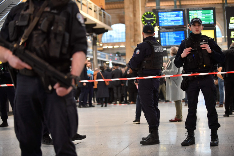 The man was arrested by police at the station, which serves as a hub for trains to London and northern Europe, after they opened fire and wounded him, said a police source, who asked not to be named.