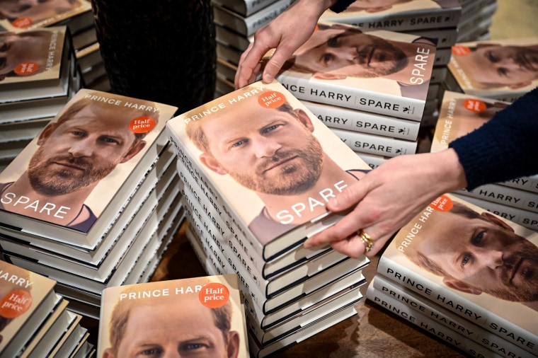Image: A bookseller holds a copy of "Spare" by Britain's Prince Harry, Duke of Sussex, at Waterstones' flagship Piccadilly bookshop on the day of its release in London, on Jan. 10, 2023.