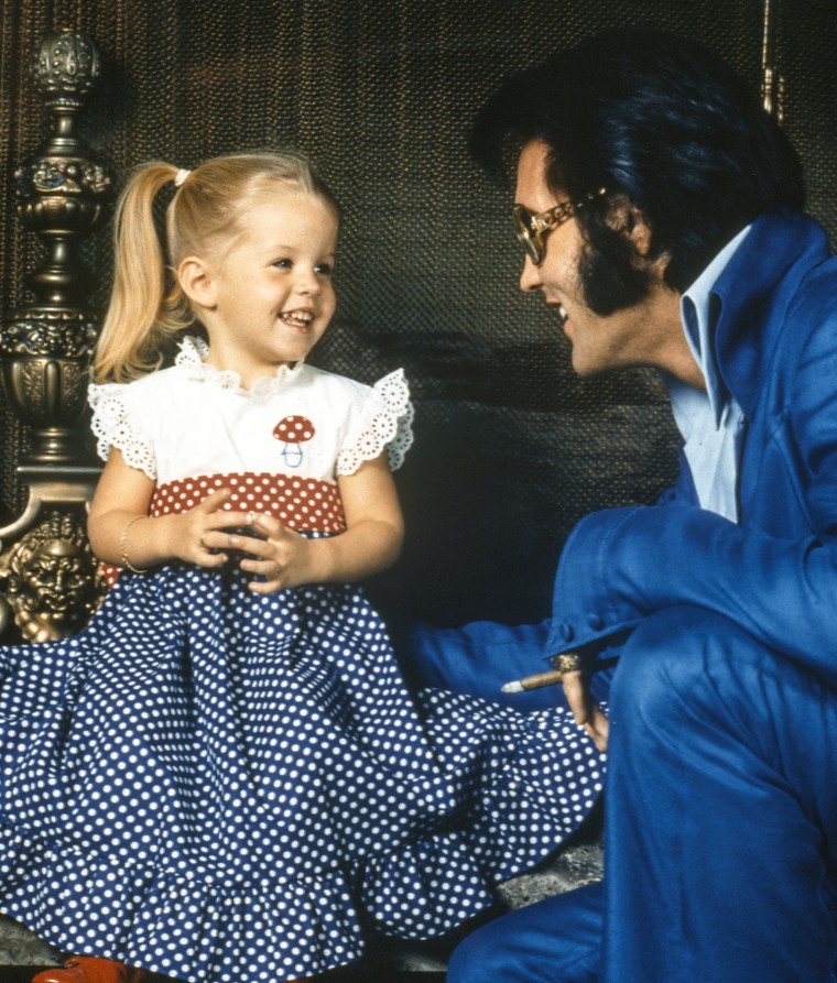 American rock legend Elvis Presley with his daughter Lisa-Marie Presley in 1973.