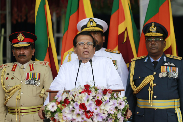 Sri Lankan President Maithripala Sirisena, center, speaks during a ceremony to pay homage at the national war heroes memorial in Colombo, Sri Lanka, Friday, May 19, 2017.  Sri Lanka marked the eighth anniversary of the end of its bloody civil war on Friday with much of the legacy and divisions created by more than quarter-century of violence still intact.