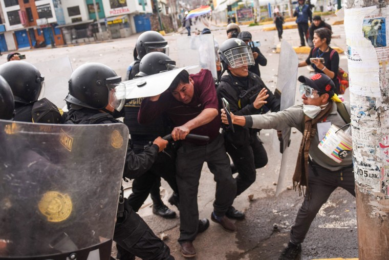 Protesters clash with members of the Peruvian riot police in Cusco on Jan. 11, 2023.