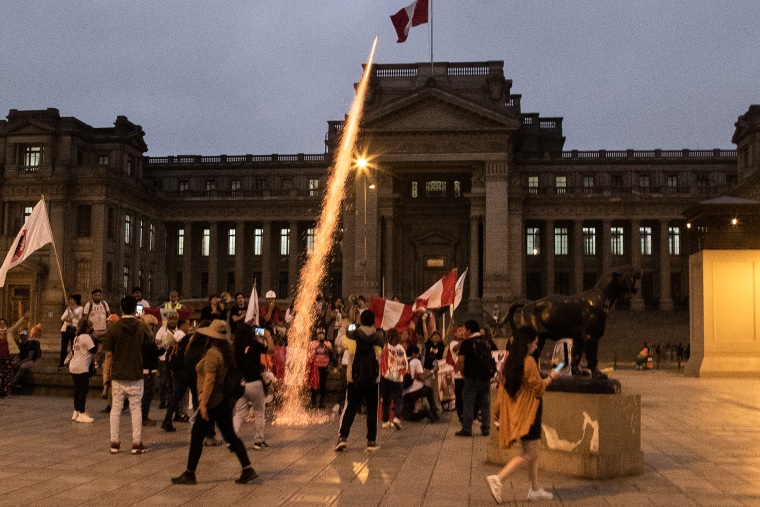 Demonstrators protest against Pedro Castillo, Peru's former president, following his impeachment and arrest, in front of the Palace of Justice in Lima on Dec. 7, 2022.