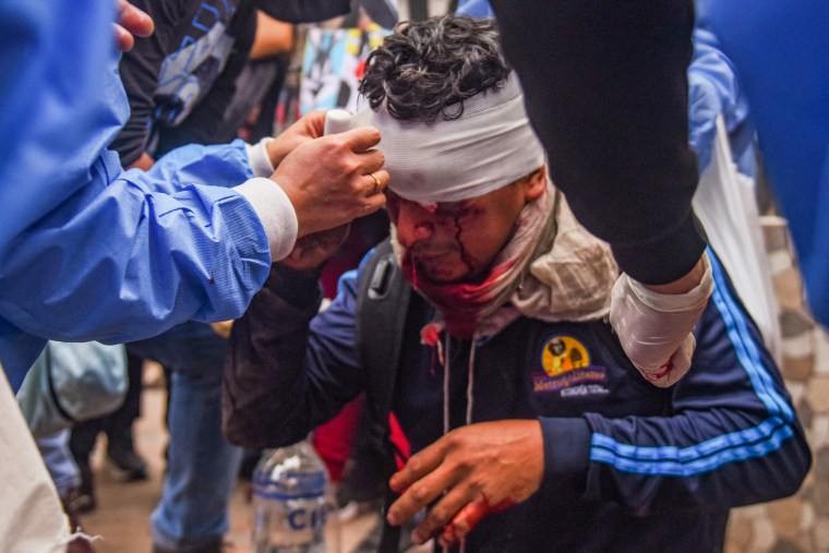 A wounded protester receives assintance during a demonstration in Cusco, Peru, on Jan. 11, 2023.