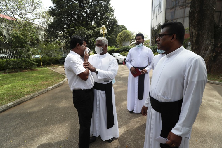 A Catholic priest tries to console a family member of one of the deceased after Sri Lanka’s Supreme Court pronounced judgment on the 2019 Easter Sunday bomb attacks in Colombo, Sri Lanka, Thursday, Jan.12, 2023.
Sri Lanka’s Supreme Court ruled Thursday that inaction by the country’s former president and four others led to the attacks that killed nearly 270 people and ordered them to pay compensation for violating the basic rights of the victims and their families.