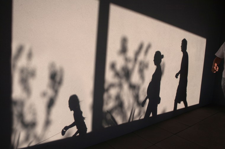 Shadow Of Family On Wall
