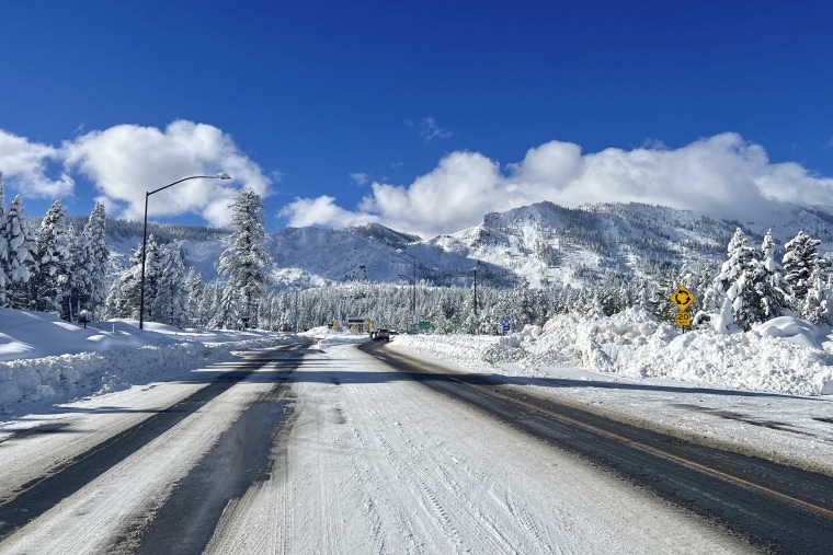 This Sunday, January 1, 2023, a photo released by Caltrans District 3 shows the Sierra Highway is reopened, but circuit control remains in place as crews clean up in South Lake Tahoe, California.  a severe storm brought heavy rain or heavy snowfall to much of the state, hampering traffic and closing roads.