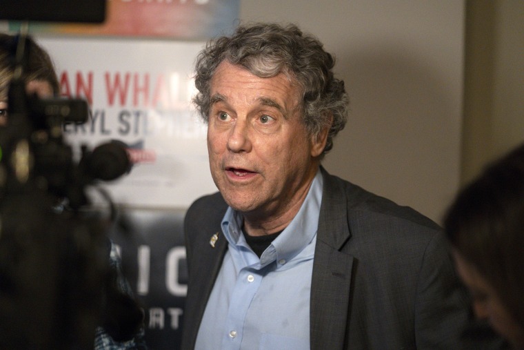 Sen. Sherrod Brown, D-Ohio, right, speaks with reporters at a rally for Ohio gubernatorial candidate Nan Whaley in Cincinnati, Thursday, Nov. 3, 2022. (AP Photo/Jeff Dean)