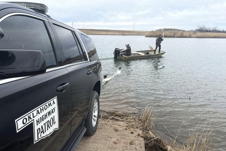 Oklahoma Highway Patrol troopers search a pond near Cyril, Okla, on Jan. 11, 2023, for Athena Brownfield.