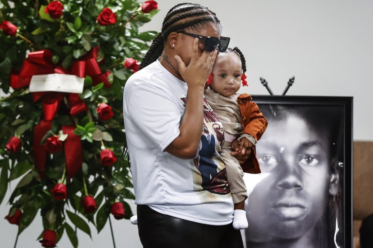 Sierra Rogers, holding her daughter Khloe Rogers, 1, wipes away tears as she speaks during a memorial service for her friend Tyre Nichols on Jan. 17, 2023, in Memphis, Tenn. 