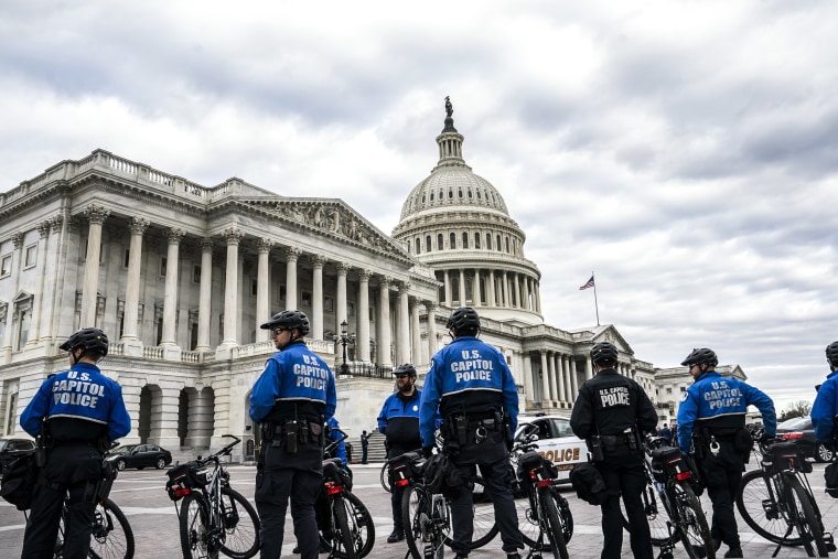Image: Capitol police officers guard the perimeter of the Capitol on Jan. 6, 2023.