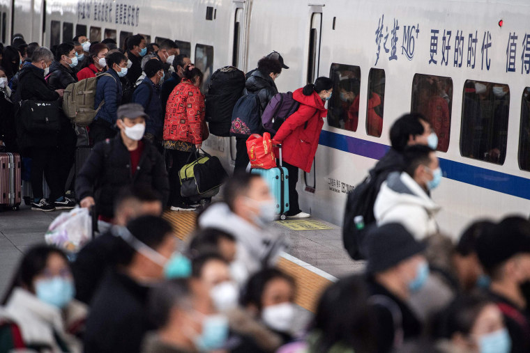 Chinese pray for health in Lunar New Year as Covid death toll rises