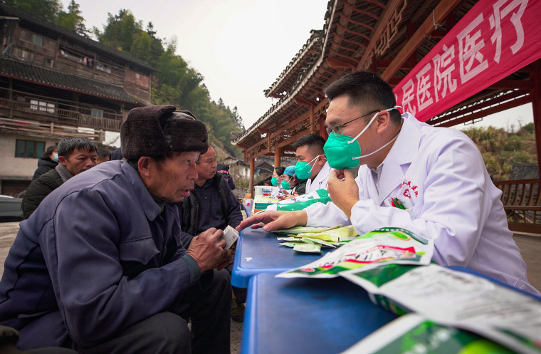 Chinese pray for health in Lunar New Year as Covid death toll rises