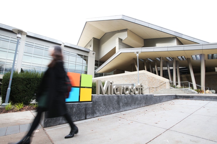 A person walks past at the Microsoft headquarters in Redmond