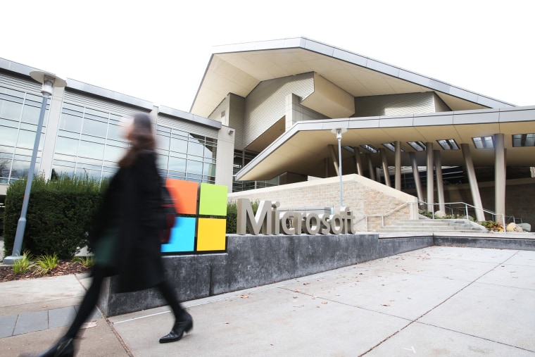 A man walks past the Microsoft headquarters in Redmond.