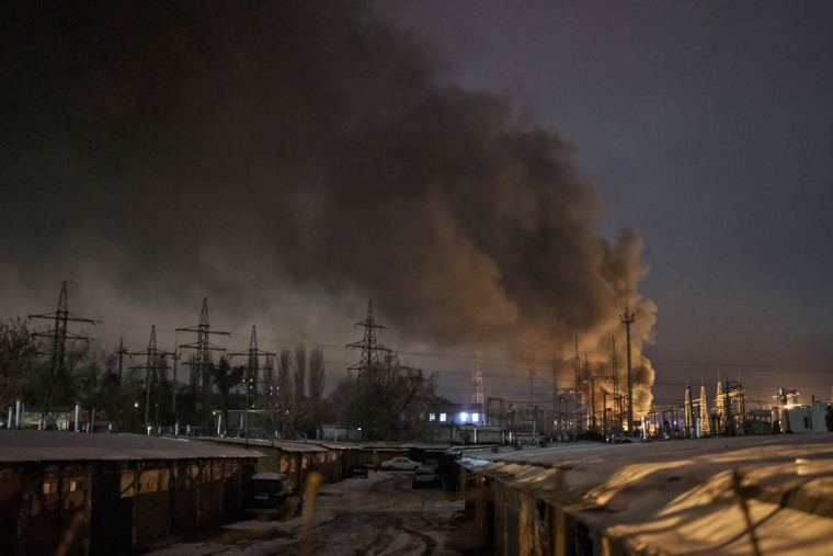 Smoke billows from power infrastructure following a Russian drone attack in Ukraine's Kyiv region on Dec. 19, 2022. 