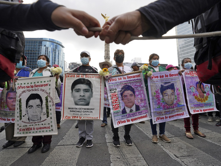 Relatives and classmates of the missing 43 college students, march in Mexico City on Sept. 26, 2022.