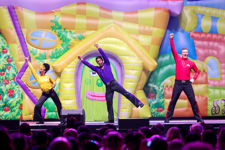 AUCKLAND, NEW ZEALAND - AUGUST 21: Tsehay Hawkins, John Pearce and Simon Pryce of The Wiggles perform on stage during the Big Show Tour! at Spark Arena on August 21, 2022 in Auckland, New Zealand.
