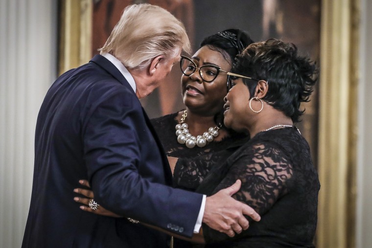 President Donald Trump  with conservative social media figures Lynnette Hardaway and Rochelle Richardson, known as the duo "Diamond and Silk" in 2019