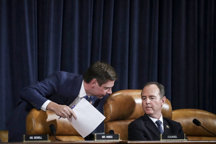 Reps. Eric Swalwell, D-Calif., confers with committee chairman Adam Schiff, D-Calif., during a House Intelligence Committee hearing on Nov. 19, 2019.