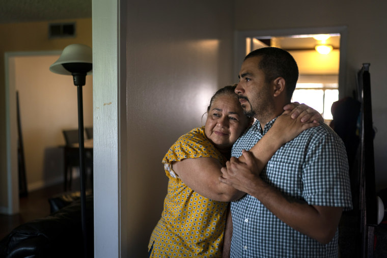 Ana Sandoval hugs her son Henry Martinez in Compton, Calif.