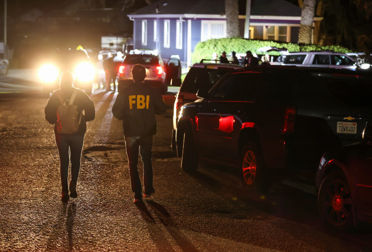 FBI agents arrive at the scene of a shooting on Jan. 23, 2023, in Half Moon Bay, Calif.