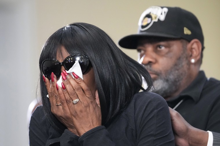 RowVaughn Wells, mother of Tyre Nichols cries as she is comforted by Tyre's stepfather Rodney Wells, at a news conference with civil rights Attorney Ben Crump in Memphis, Tenn.